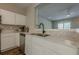Modern kitchen with stainless steel appliances, white cabinets, and granite countertops at 9155 Nesbit Ferry Rd # 65, Alpharetta, GA 30022