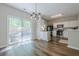 Bright kitchen with stainless steel appliances, dining area, and sliding door to outdoor space at 9155 Nesbit Ferry Rd # 65, Alpharetta, GA 30022