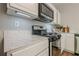 Close up on a kitchen featuring stainless steel appliances and stunning granite countertops at 9155 Nesbit Ferry Rd # 65, Alpharetta, GA 30022