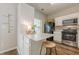 Bright kitchen features stainless steel appliances, white cabinets, and a cozy breakfast bar at 9155 Nesbit Ferry Rd # 65, Alpharetta, GA 30022