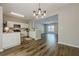 Open-concept layout features a dining area which flows into the kitchen and living room at 9155 Nesbit Ferry Rd # 65, Alpharetta, GA 30022