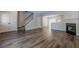 Spacious living room with hardwood floors, fireplace, and open layout at 9155 Nesbit Ferry Rd # 65, Alpharetta, GA 30022