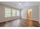 Bedroom featuring vaulted ceiling, LVP flooring and doorway to en suite bathroom at 9155 Nesbit Ferry Rd # 65, Alpharetta, GA 30022