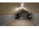 The attic features an open layout with hardwood flooring and a skylight at 265 Winding Stream Trl, Hampton, GA 30228