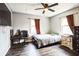 The bedroom features hardwood flooring, neutral walls and a large window providing lots of light at 265 Winding Stream Trl, Hampton, GA 30228