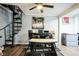 This cozy dining area includes a spiral staircase to the upper level and hardwood flooring at 265 Winding Stream Trl, Hampton, GA 30228
