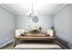Elegant dining room with a large wooden table, comfortable seating, and stylish chandelier at 265 Winding Stream Trl, Hampton, GA 30228