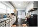 The kitchen features updated countertops, stainless steel appliances, and tile flooring at 265 Winding Stream Trl, Hampton, GA 30228