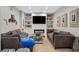 Comfortable basement living area with cozy seating and a fireplace for gatherings and movie nights at 997 Woodbury Rd, Canton, GA 30114