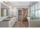 A bathroom with a soaking tub, a rustic barn door, and a walk in shower at 997 Woodbury Rd, Canton, GA 30114