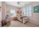 A bedroom decorated in light pink with a bed and neutral toned carpet at 997 Woodbury Rd, Canton, GA 30114