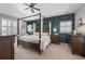 A primary bedroom featuring a four poster bed and an accent wall at 997 Woodbury Rd, Canton, GA 30114