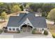 Community clubhouse showcasing covered seating, picnic tables, and well maintained landscaping at 997 Woodbury Rd, Canton, GA 30114