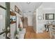 Spacious foyer with hardwood floors, coat rack, and staircase leading to the upper level at 997 Woodbury Rd, Canton, GA 30114
