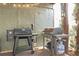 Outdoor grilling area featuring a combination of charcoal and gas grills at 997 Woodbury Rd, Canton, GA 30114