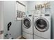 Convenient laundry room with modern appliances and storage space for all of your needs at 997 Woodbury Rd, Canton, GA 30114