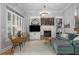 Comfortable living room with fireplace, built-ins, and large windows, creating an inviting space at 997 Woodbury Rd, Canton, GA 30114