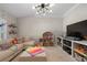 Inviting living room offers a bright space, modern lighting, and room for games at 997 Woodbury Rd, Canton, GA 30114
