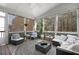 Relaxing sunroom with ample seating, large windows, and a view of the outdoors at 997 Woodbury Rd, Canton, GA 30114