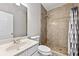 Bathroom with a tiled shower with a rainfall shower head, modern vanity and fixtures at 1721 Telfair Chase Way, Lawrenceville, GA 30043