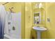 Cozy bathroom with a shower and a pedestal sink at 1721 Telfair Chase Way, Lawrenceville, GA 30043
