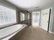 Modern bathroom with large tub, a glass shower, and an adjoining walk-in closet at 1721 Telfair Chase Way, Lawrenceville, GA 30043