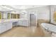Bright bathroom featuring a large vanity, soaking tub, and separate shower area, creating a spa-like retreat at 1721 Telfair Chase Way, Lawrenceville, GA 30043