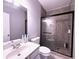 Modern bathroom showcasing tiled shower with a black frame and gray walls at 1721 Telfair Chase Way, Lawrenceville, GA 30043