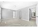 Spacious bedroom with neutral walls and carpet, offering lots of natural light at 1721 Telfair Chase Way, Lawrenceville, GA 30043