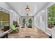 Bright exercise room with hardwood floors, lots of natural light, and access to an outdoor balcony at 1721 Telfair Chase Way, Lawrenceville, GA 30043