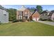 Stunning two-story brick home with lush landscaping and a two-car garage, exuding elegance and comfort at 1721 Telfair Chase Way, Lawrenceville, GA 30043