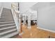 Bright foyer with hardwood floors, staircase, and views into the dining room at 1721 Telfair Chase Way, Lawrenceville, GA 30043