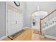 Welcoming foyer featuring a double door entry, hardwood floors, and staircase at 1721 Telfair Chase Way, Lawrenceville, GA 30043