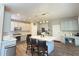 Well-lit kitchen boasts stainless steel appliances, a center island with seating, and light gray cabinets at 1721 Telfair Chase Way, Lawrenceville, GA 30043