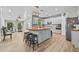 Open kitchen with a butcher block island and breakfast bar, adjacent to an exercise room at 1721 Telfair Chase Way, Lawrenceville, GA 30043
