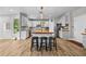Bright eat-in kitchen features a large butcher block island with seating and stainless steel appliances at 1721 Telfair Chase Way, Lawrenceville, GA 30043