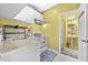 Small kitchenette features white cabinets, and a gas range at 1721 Telfair Chase Way, Lawrenceville, GA 30043