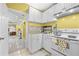 Small kitchenette with overhead cabinets, a gas range and tile floors at 1721 Telfair Chase Way, Lawrenceville, GA 30043
