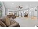 Open concept living area flowing into kitchen and dining room at 1721 Telfair Chase Way, Lawrenceville, GA 30043