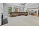 Spacious living room with large windows and a modern, open floor plan and ceiling fan at 1721 Telfair Chase Way, Lawrenceville, GA 30043