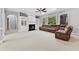 Living room with a fireplace, built-in shelves, and large windows at 1721 Telfair Chase Way, Lawrenceville, GA 30043