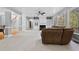 Spacious living room with carpet, fireplace, and views of the backyard at 1721 Telfair Chase Way, Lawrenceville, GA 30043