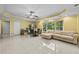 Bright living room with tile flooring and a beige sectional sofa at 1721 Telfair Chase Way, Lawrenceville, GA 30043