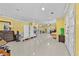 Bright living room with tile flooring, and yellow walls at 1721 Telfair Chase Way, Lawrenceville, GA 30043