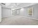 Large main bedroom features carpet, a tray ceiling, and bright windows with blinds at 1721 Telfair Chase Way, Lawrenceville, GA 30043