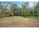 Spacious backyard with mature trees and greenery, providing a serene outdoor setting at 2112 Palmyra Dr, Marietta, GA 30067