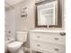 Well-lit bathroom showcasing a vanity with drawers, a mirror, and a shower-tub combination at 2112 Palmyra Dr, Marietta, GA 30067
