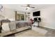 Comfortable bedroom features a workstation, mounted TV, neutral paint and a large window at 2112 Palmyra Dr, Marietta, GA 30067