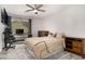Cozy bedroom with neutral tones, ceiling fan, and a window, creating a comfortable retreat at 2112 Palmyra Dr, Marietta, GA 30067