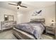 Bedroom featuring a rustic wood bed frame, dresser, nightstand, neutral decor and wood-look flooring at 2112 Palmyra Dr, Marietta, GA 30067